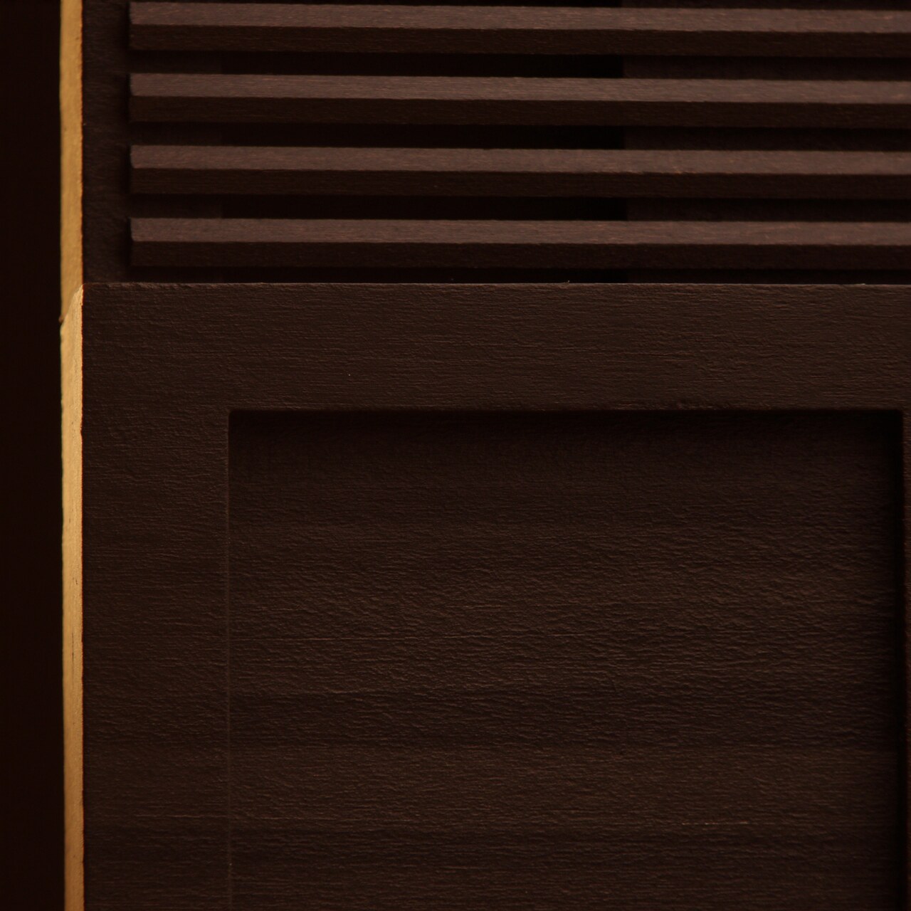 Dark-stained wood slat